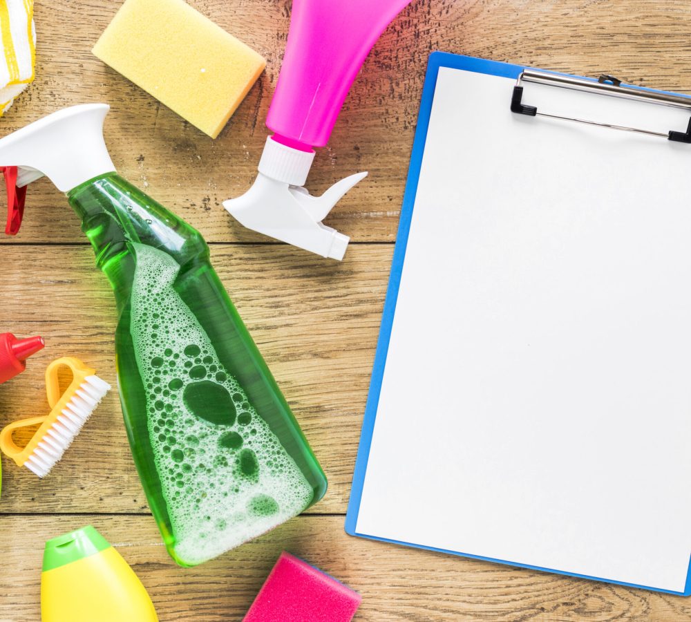 view-arrangement-with-cleaning-products-clipboard